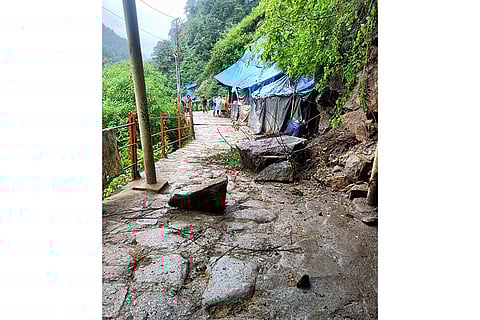 Debris lies on a road after landslide